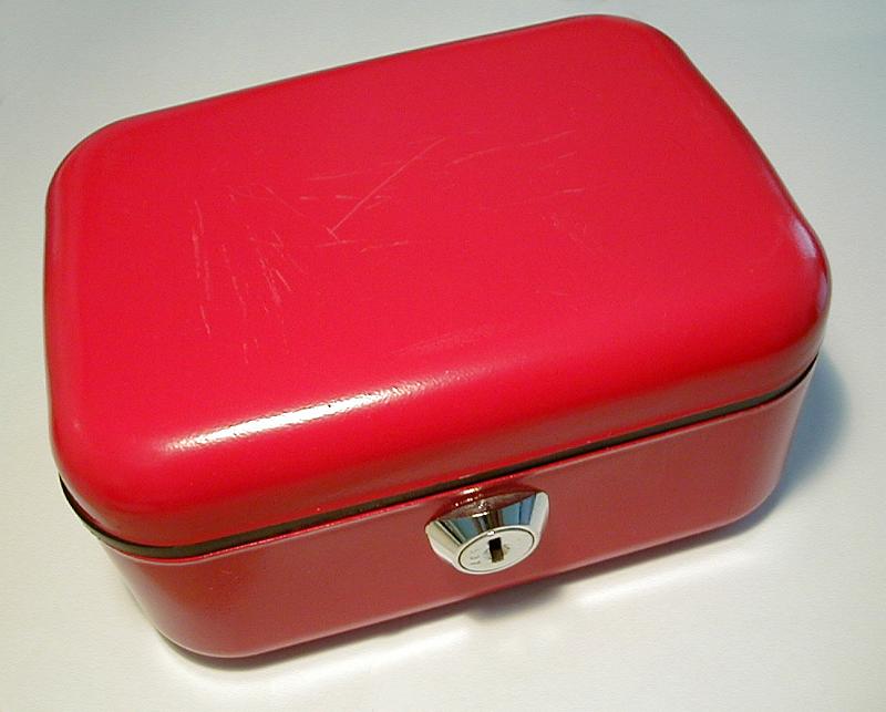 Free Stock Photo: High Angle View of Red Money or Cash Box with Shiny Silver Lock and Scratched Top on White Background