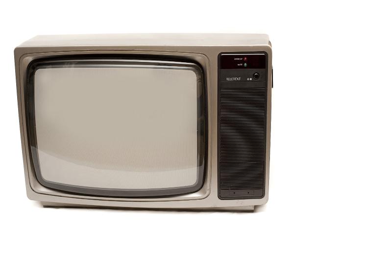 Free Stock Photo: Small portable retro television set with a blank screen on white facing the camera