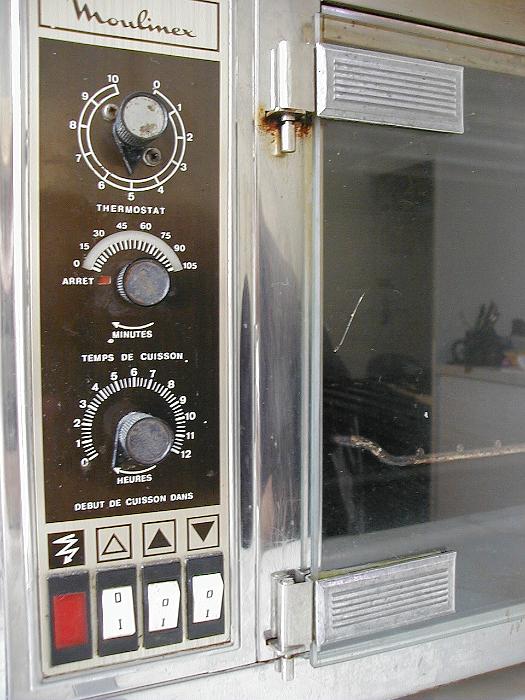 Free Stock Photo: Closeup angled cropped view of the control panel of a built in domestic oven with a glass door