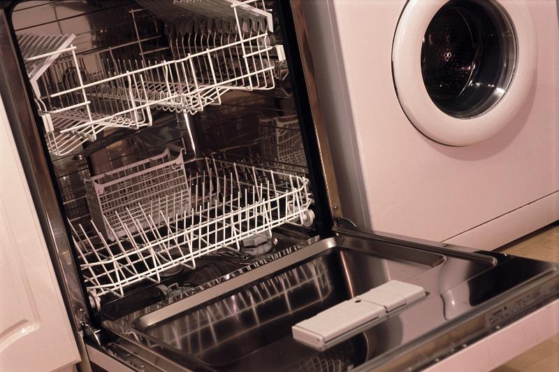 Free Stock Photo: Stainless steel interior and racks of an empty dishwasher with its front door lowered