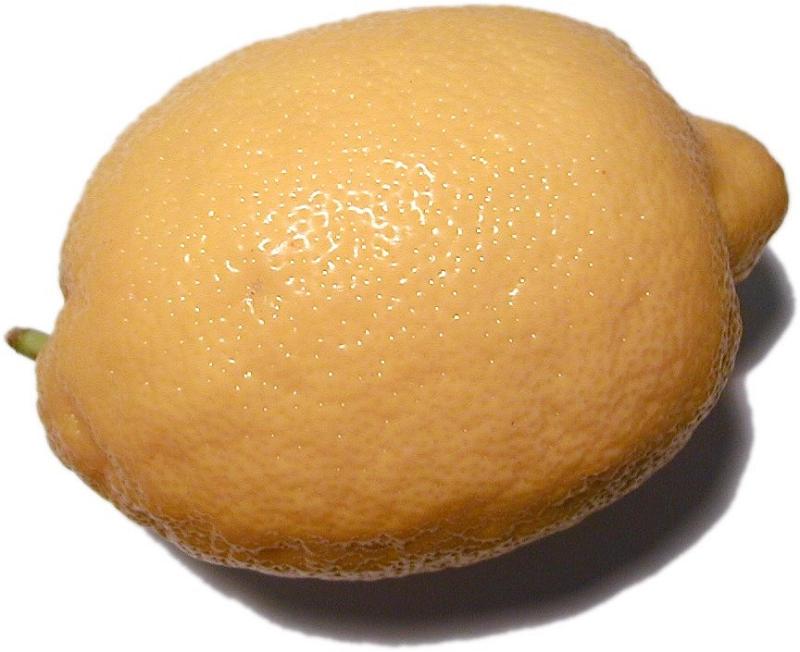 Free Stock Photo: Close-up shot of a yellow lemon on a white background