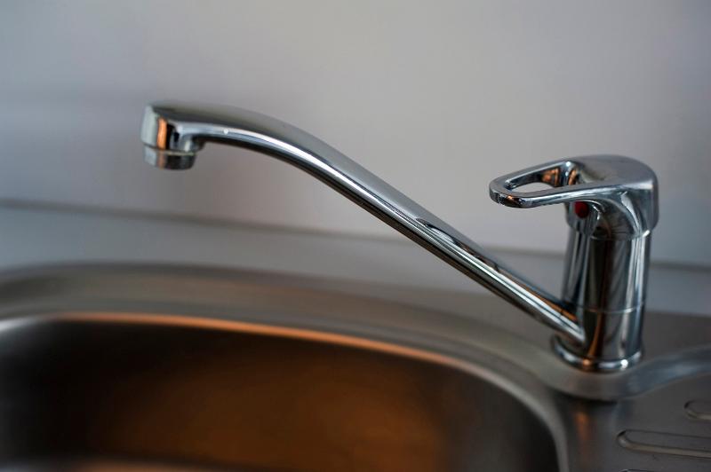 Free Stock Photo: Detail of a modern chrome mono block kitchen tap over a stainless steel kitchen sink