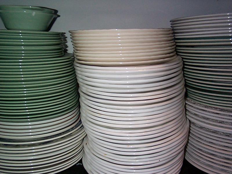 Free Stock Photo: Large stack of clean dishes and crockery on a kitchen shelf in a home or restaurant for dining and eating