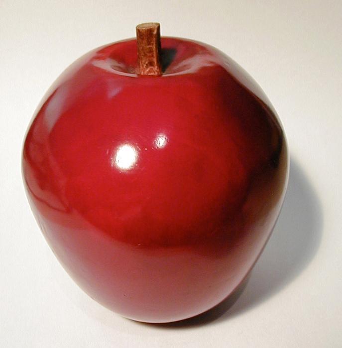 Free Stock Photo: Close-up of a shiny red ceramic decorative apple, with shadow, on light grey background