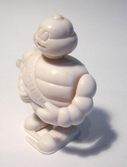 Free Stock Photo: Full Length Still Life of Wind Up Plastic Bebbendum Michelin Man Mascot Toy in Studio with White Background
