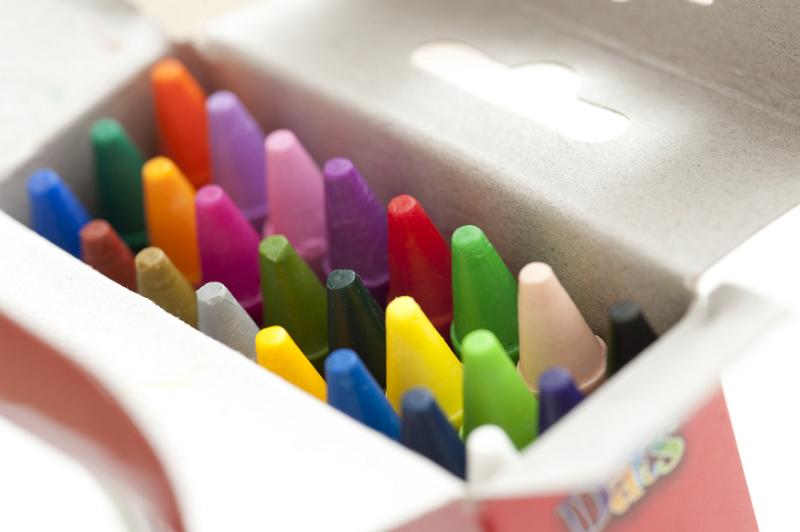 Free Stock Photo: Open box of multicolored wax crayons with focus to the tips in the colors of the spectrum in a artistic, creativity and educational concept