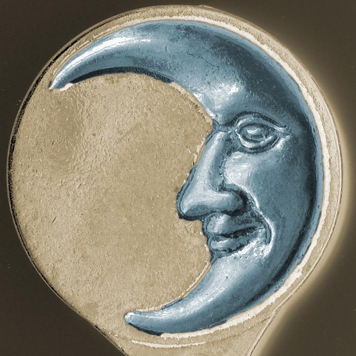 Free Stock Photo: Decorative smiling moon metal plaque with a silver Man in the Moon on a beige disk over black in a square format