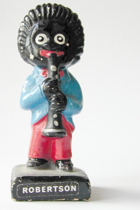 Free Stock Photo: Old vintage black Golly Wog figurine of a musician playing a clarinet, now considered racist and out of favor