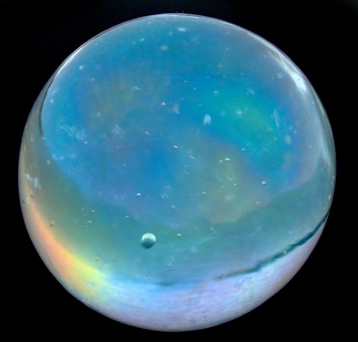 Free Stock Photo: a glass marble on a black background