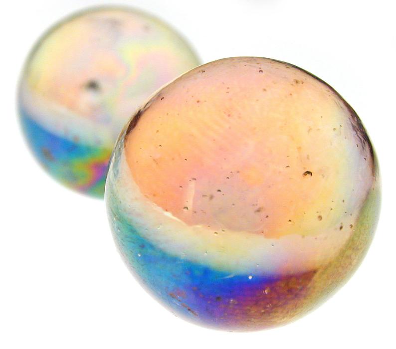 Free Stock Photo: Close up of two toy marbles with clear and violet designs on isolated background