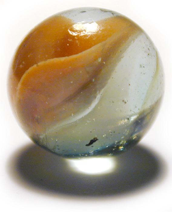 Free Stock Photo: A glass marble lit from above with light shining through