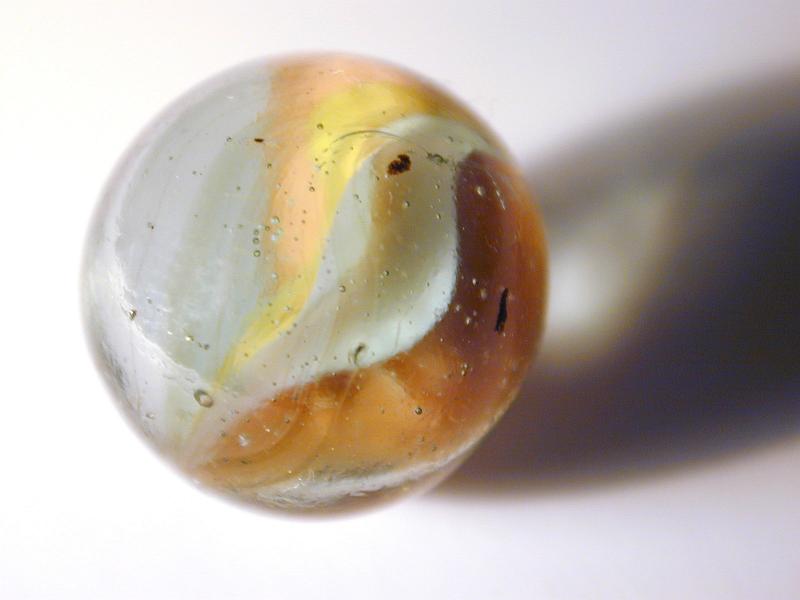 Free Stock Photo: Single brown and white swirled marble with shadow over white background