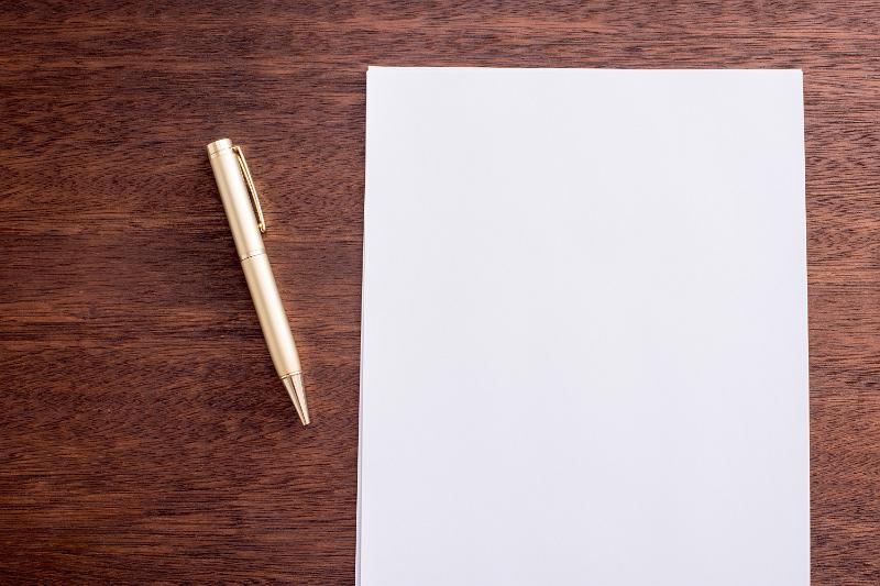 Free Stock Photo: Starting with a clean slate concept showing a blank empty page of white paper lying beside a pen on a desk