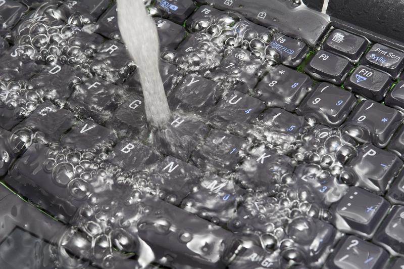 Free Stock Photo: Running water on PC keyboard. Washing computer concept of cleaning old data