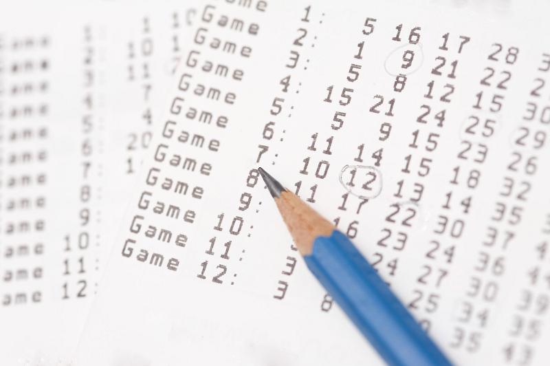 Free Stock Photo: Close-up on checking lotto winning numbers with pencil. Lottery game concept full frame image