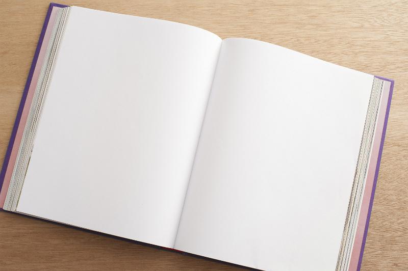 Free Stock Photo: Overhead view of an open book with blank pages in a double spread on a wooden desk conceptual of transparency, communication, business or new beginnings