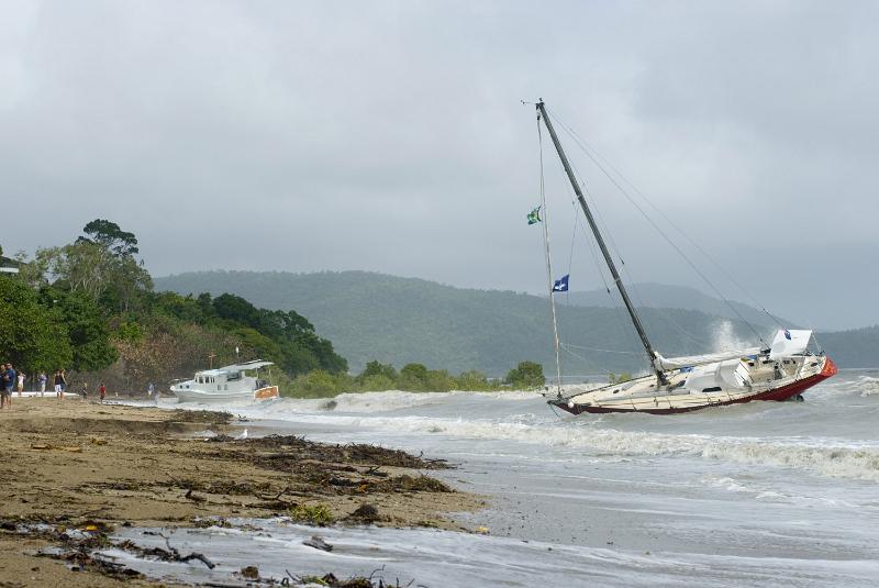 Free Stock Photo: Shipwrecked yacht lies aground near the shore during storm wind in tropical sea