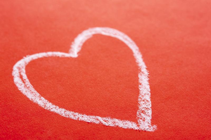 Free Stock Photo: White chalk hand drawn Valentines heart on a textured red background with copyspace for a message to your sweetheart