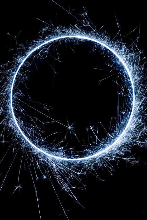 Free Stock Photo: blue circle of catherine wheel sparks on a dark background