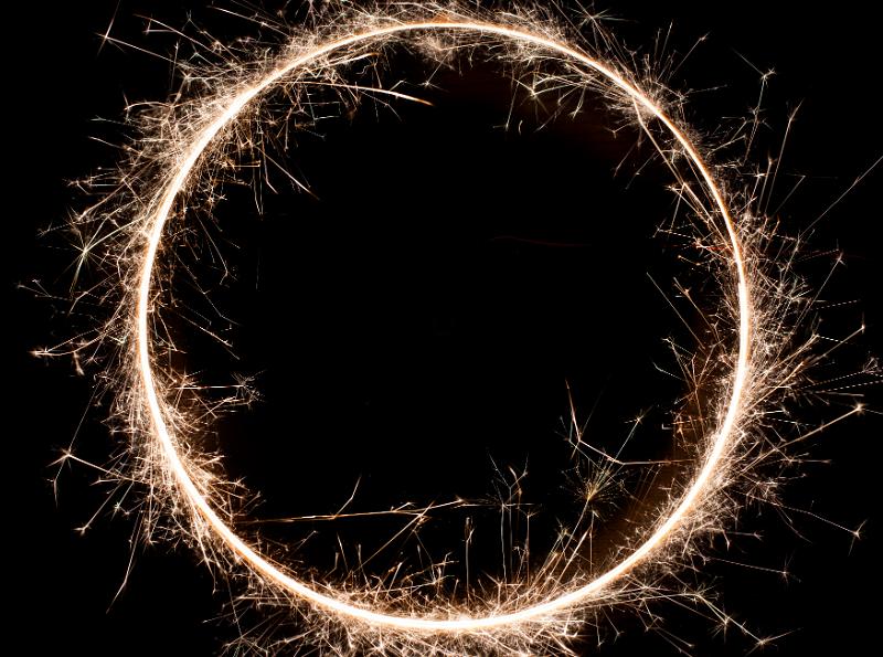 Free Stock Photo: a complete circle of warm white sparks on a black background