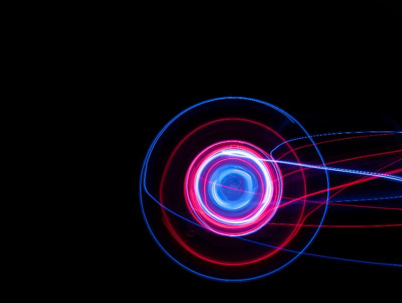 Free Stock Photo: a spinning lightpainting with circular pattern and trails of light in red and blue