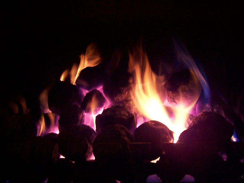 Free Stock Photo: flames licking up from hot coals on an open fire