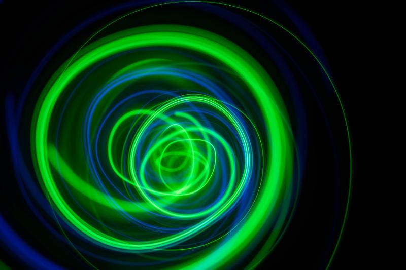 Free Stock Photo: a chaotic vortex of green and blue light trails spinning into the distance
