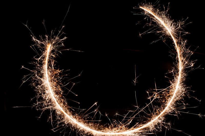Free Stock Photo: three quarter complete circle of sparks on a black background