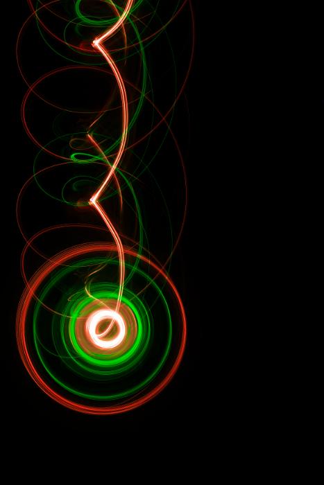 Free Stock Photo: spinning illuminated shape with trails of twisted light appearing to fall down the sceen