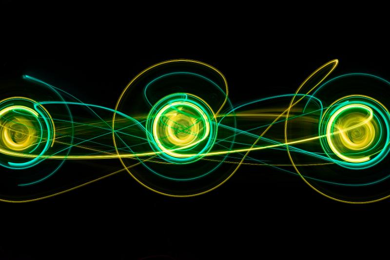 Free Stock Photo: a trio of circular light painting in green and yellow with interconnected curves