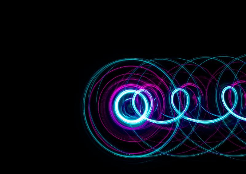 Free Stock Photo: prolate trochoid pattern plotted with cyan and pink light on a dark background