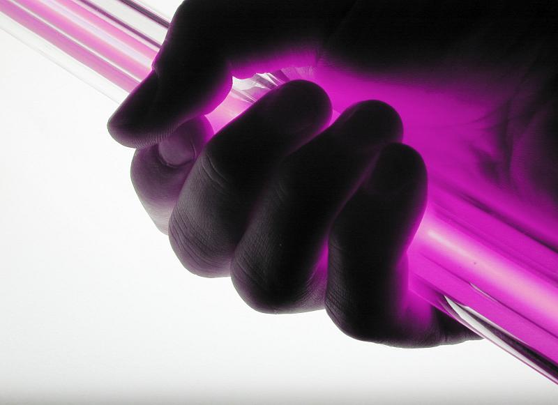 Free Stock Photo: a hand grasping a pink coloured neon tube