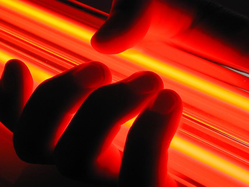 Free Stock Photo: fingers grasping a pair of glowing neon tube lights
