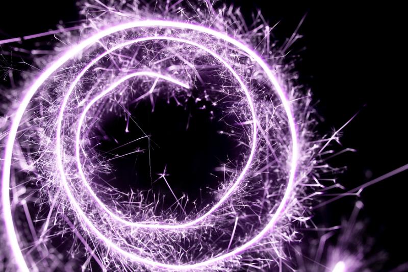Free Stock Photo: purple or lilac coloured spiral of sparkling light trails