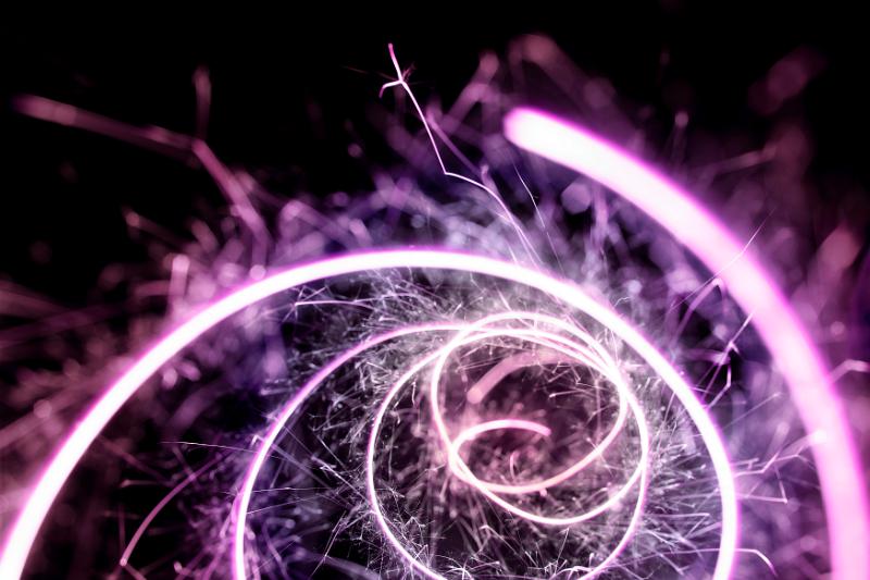Free Stock Photo: a pink and purple tinted looping trail of glowing sparks