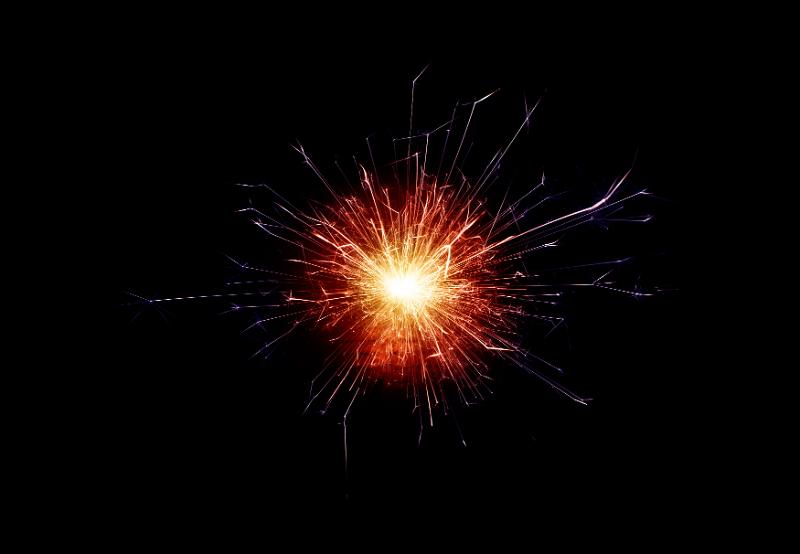 Free Stock Photo: a burst of sparks with colorful hot tinting and streaking trails for a central point
