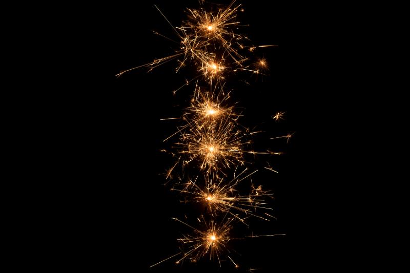 Free Stock Photo: a vertical line of warm coloured sparks of light depicting the number 1