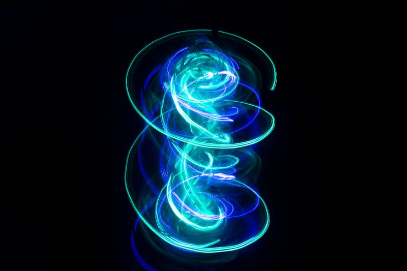 Free Stock Photo: a spinning light painted effect with vivid swirls of curved cyan and blue light