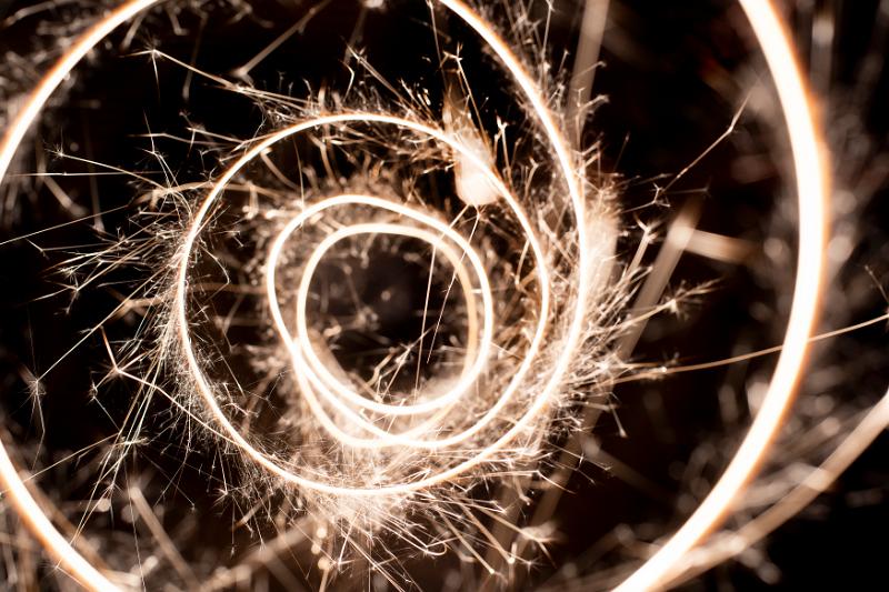 Free Stock Photo: a dynamic background of looping sparkling light trails with a central opening