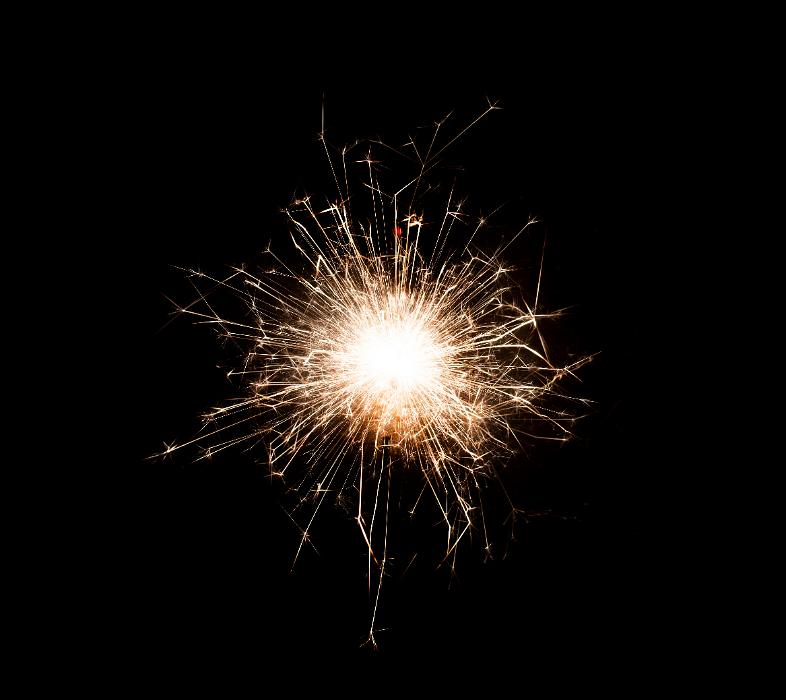 Free Stock Photo: a glowing burst of sparks with a bright central point