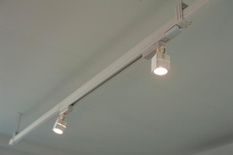 Free Stock Photo: illuminated modern halogen track lights on a white ceiling