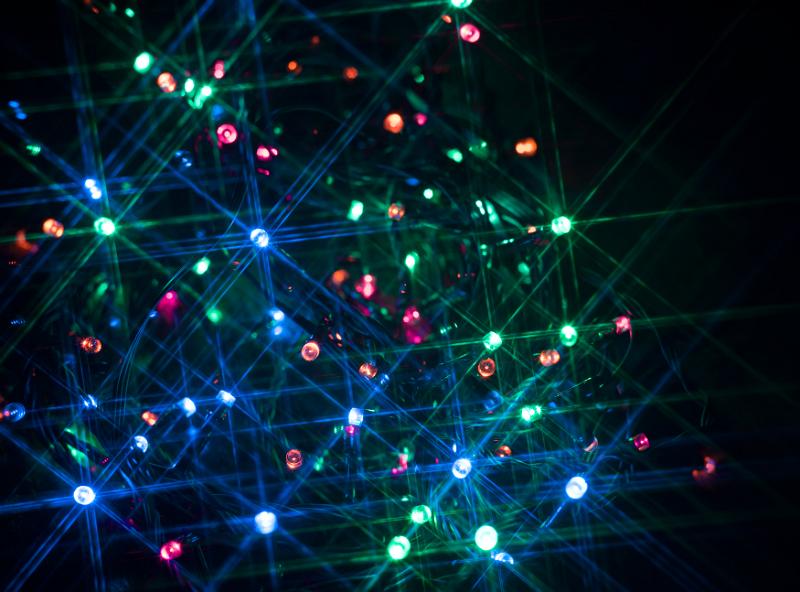 Free Stock Photo: a background of red green and blue festive lights with a starburst effect