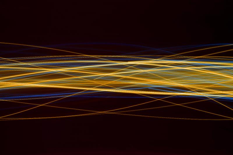 Free Stock Photo: a complicated ribbon of overlapping and interweaving waves of yellow and blue light