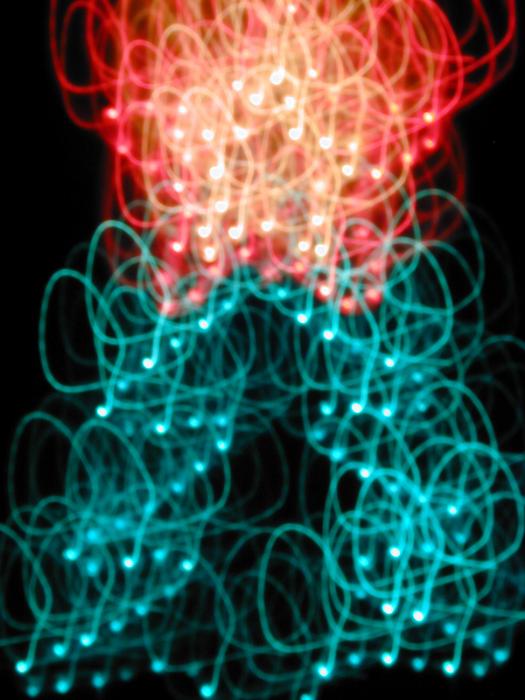 Free Stock Photo: an abstracted christmas treeshape with lightpainted motion effect