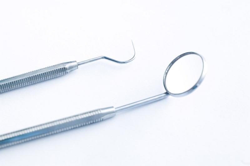 Free Stock Photo: dentists tools with a blue tint on a white background