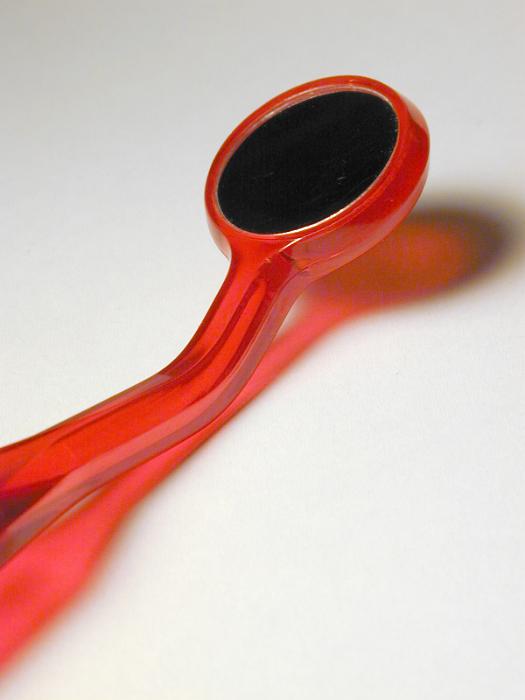 Free Stock Photo: Close Up Detail of Red Plastic Dental Mirror Used by Dentist for Examining Teeth