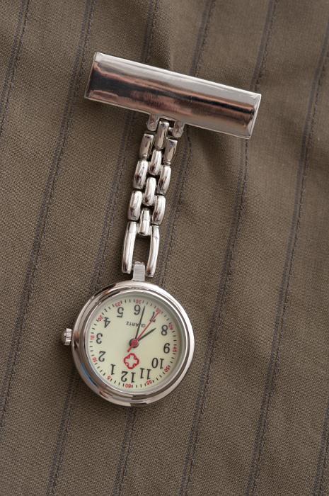 Free Stock Photo: Nurses silver metal fob watch on a chain with a clip for fastening it to her uniform
