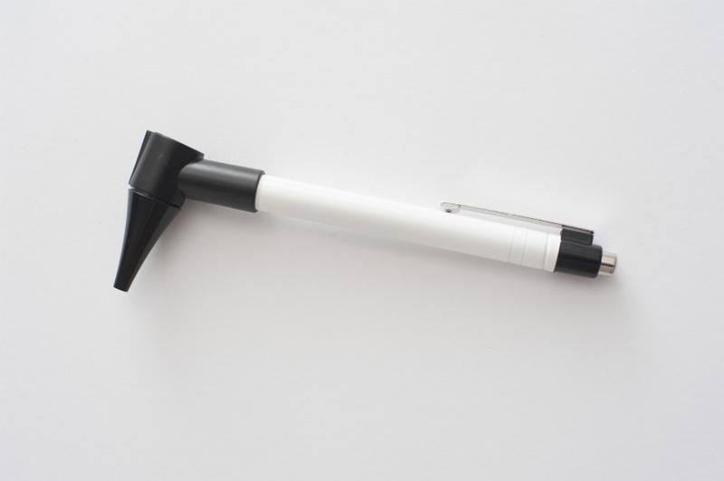 Free Stock Photo: Doctors otoscope for examining the interior of ears lying on a white background with copy space