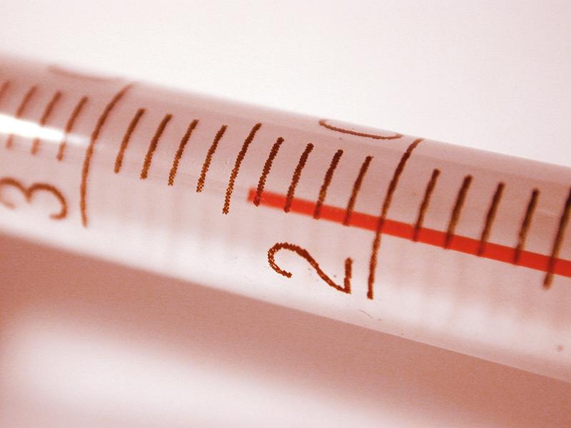 Free Stock Photo: Cylindrical mercury-in-glass thermometer for measurement of temperature 24 degrees, close-up with shadow and copy space on grey