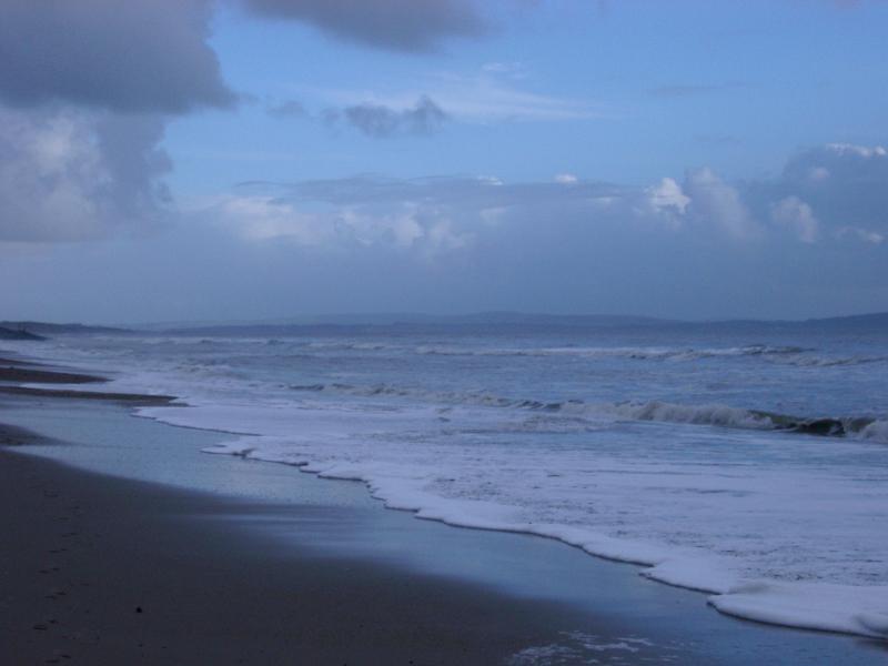 Free Stock Photo: waves breaking under a stormy looking sky